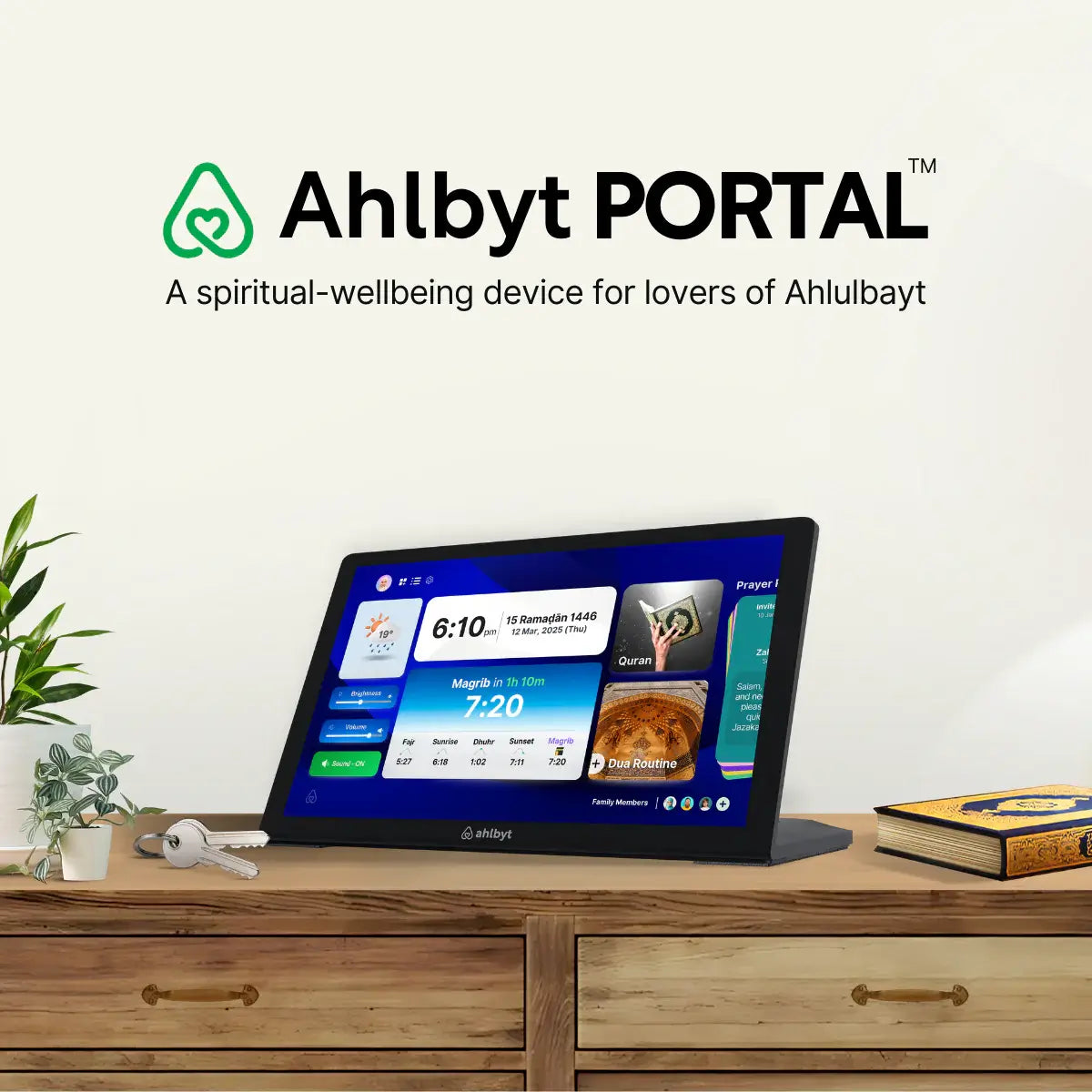 Ahlbyt Portal device on a wooden surface with a plant and book in the background