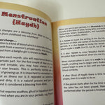 Open book with text on menstruation and religious practices