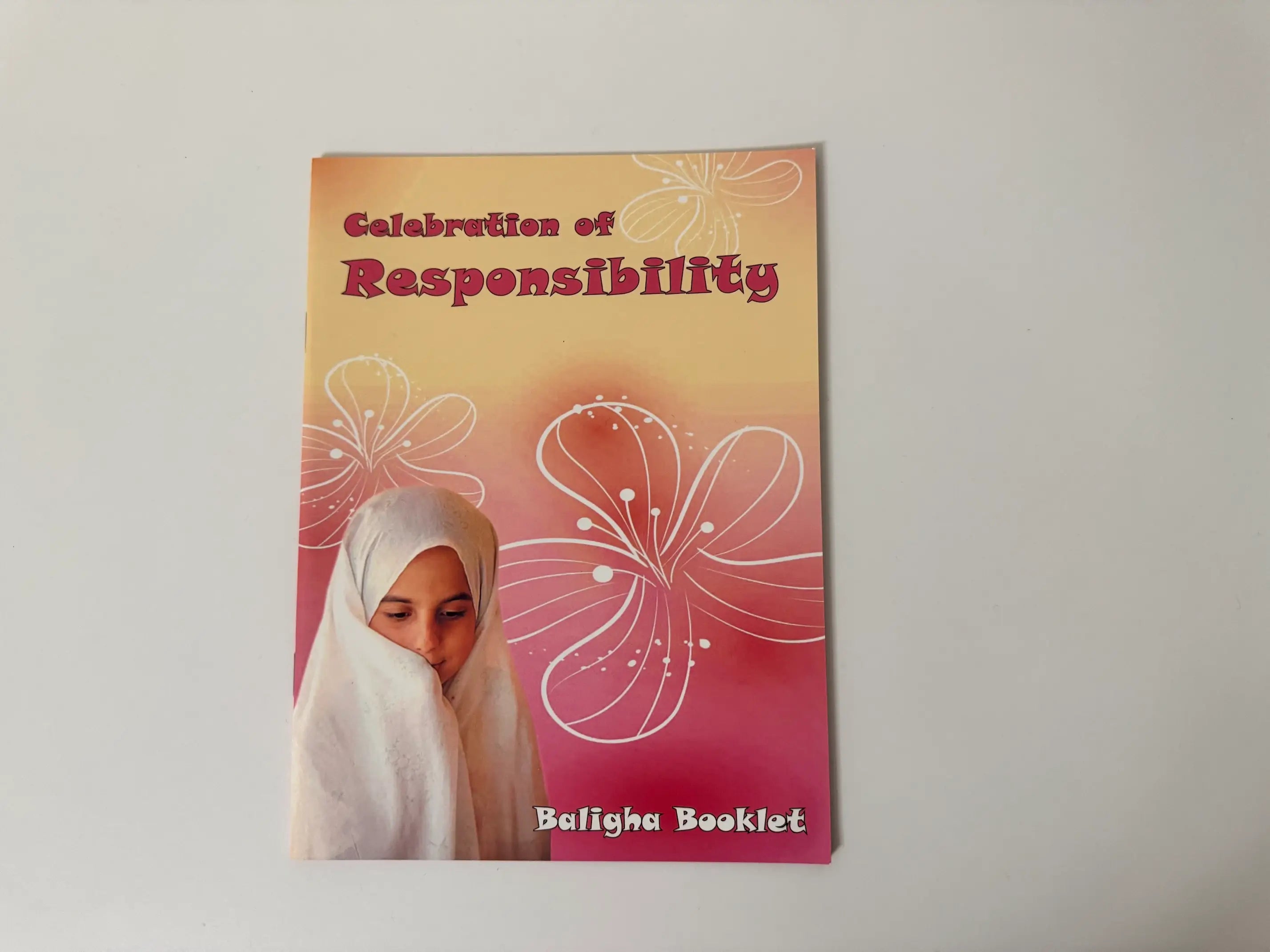 Booklet titled 'Celebration of Responsibility' with a floral design on a plain background