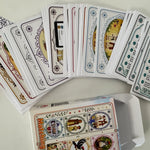 Collection of snap and memory match game cards with various designs on a white surface