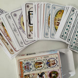 Collection of snap and memory match game cards with various designs on a white surface