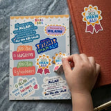Sheet of colorful Eid al-Ghadir stickers, with a hand reaching for one of the stickers.