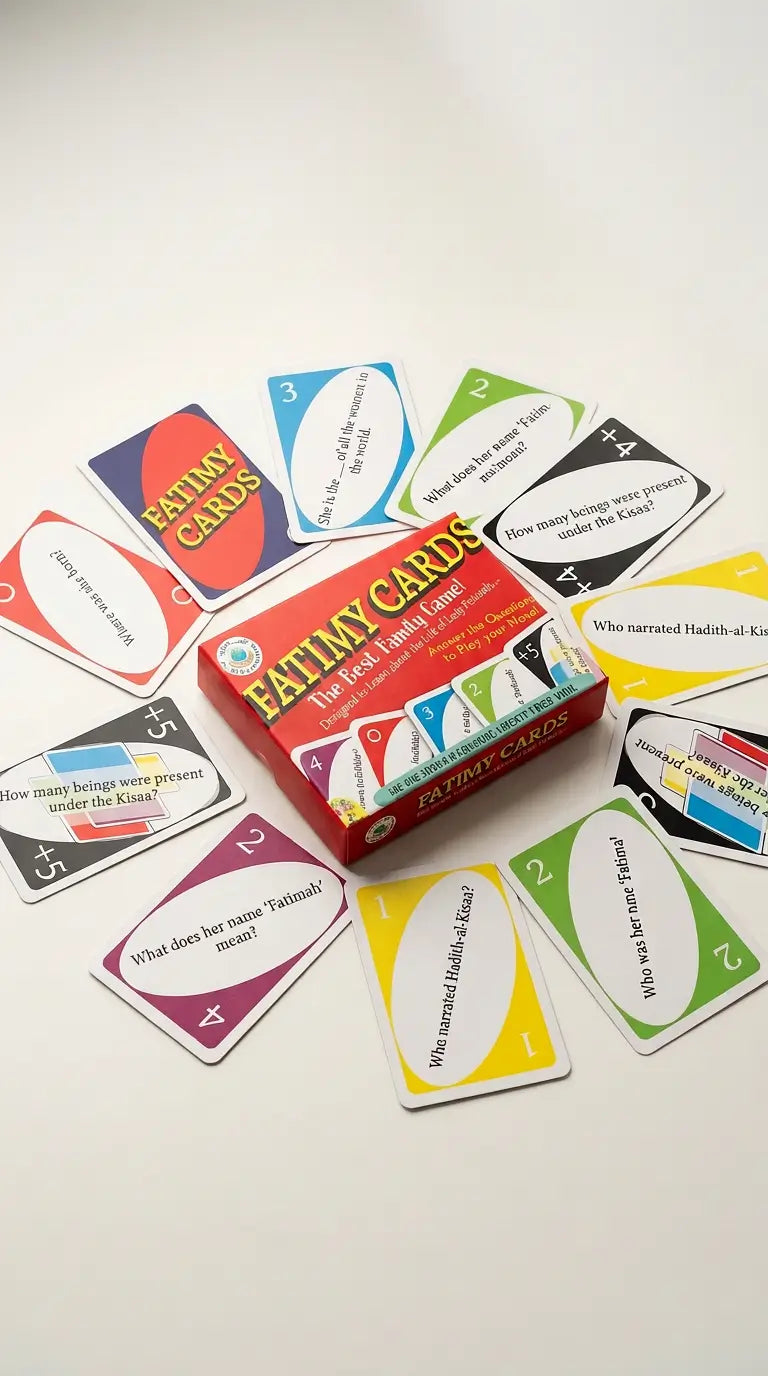 A box of Fatimy Cards surrounded by scattered colorful cards on a plain light background. The box is red with multicolored graphics and the text 'FATIMY CARDS' prominently visible.