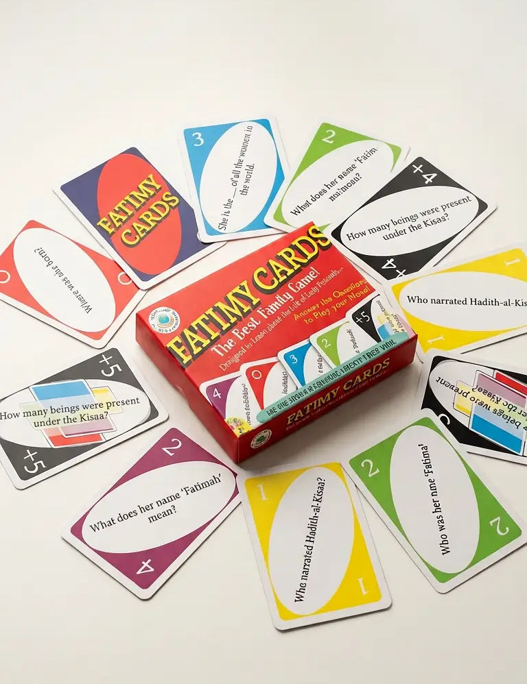 A box of Fatimy Cards surrounded by scattered colorful cards on a plain light background. The box is red with multicolored graphics and the text 'FATIMY CARDS' prominently visible.