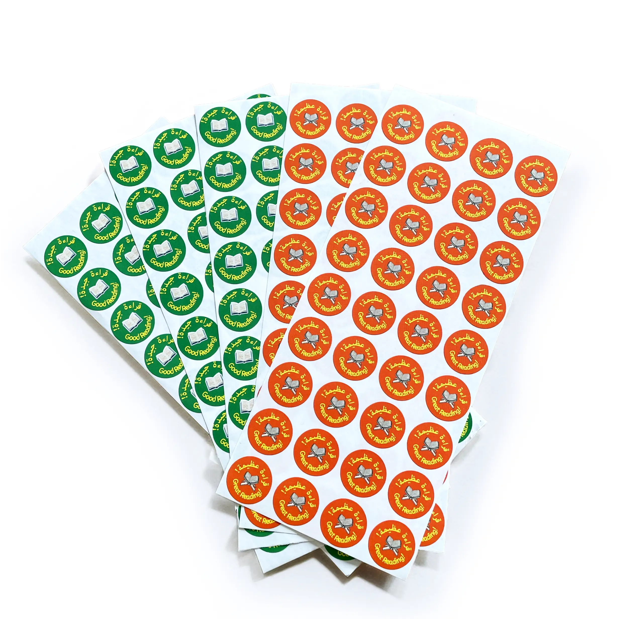 Two sheets of Arabic school stickers with green, orange, and red designs on a white background