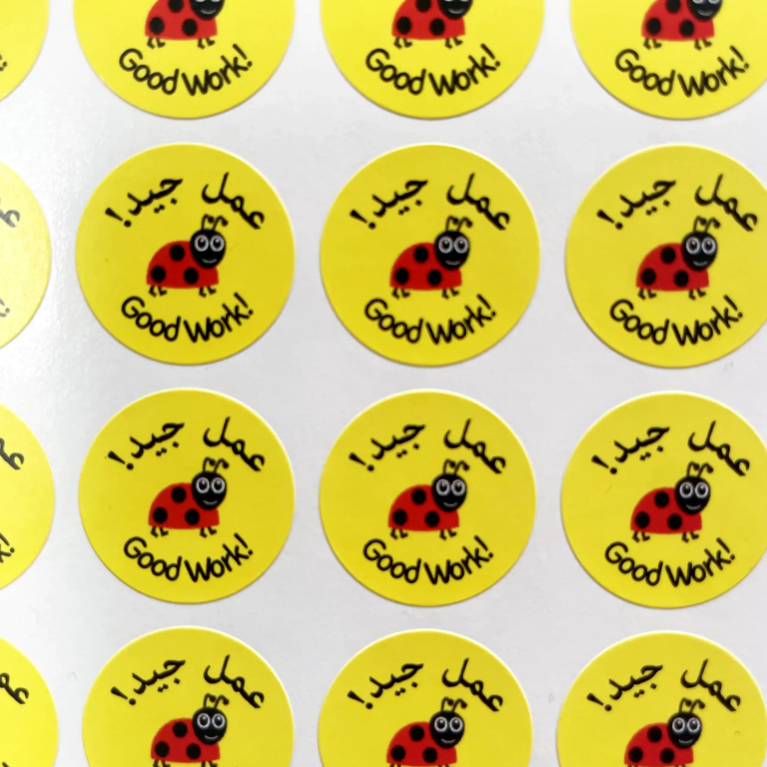 Yellow stickers with ladybug graphics and text on a white background