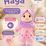 Promotional graphic for the Haya Hijabi Talking Doll, showing a plush doll wearing a pink hijab and dress with purple accents, surrounded by feature callouts and text on a soft beige background.