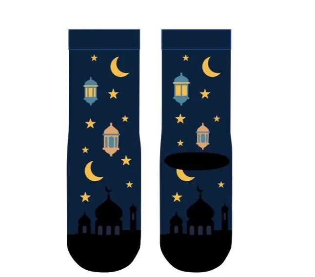 A pair of dark navy blue socks with a festive Ramadan night print, featuring yellow crescent moons, stars, lanterns, and mosque silhouettes, displayed on a solid white background.