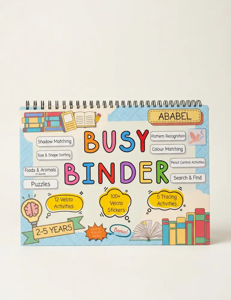 A colourful spiral-bound children's activity binder titled 'BUSY BINDER' with the name 'ABABEL' printed on the cover, photographed against a plain light beige background.