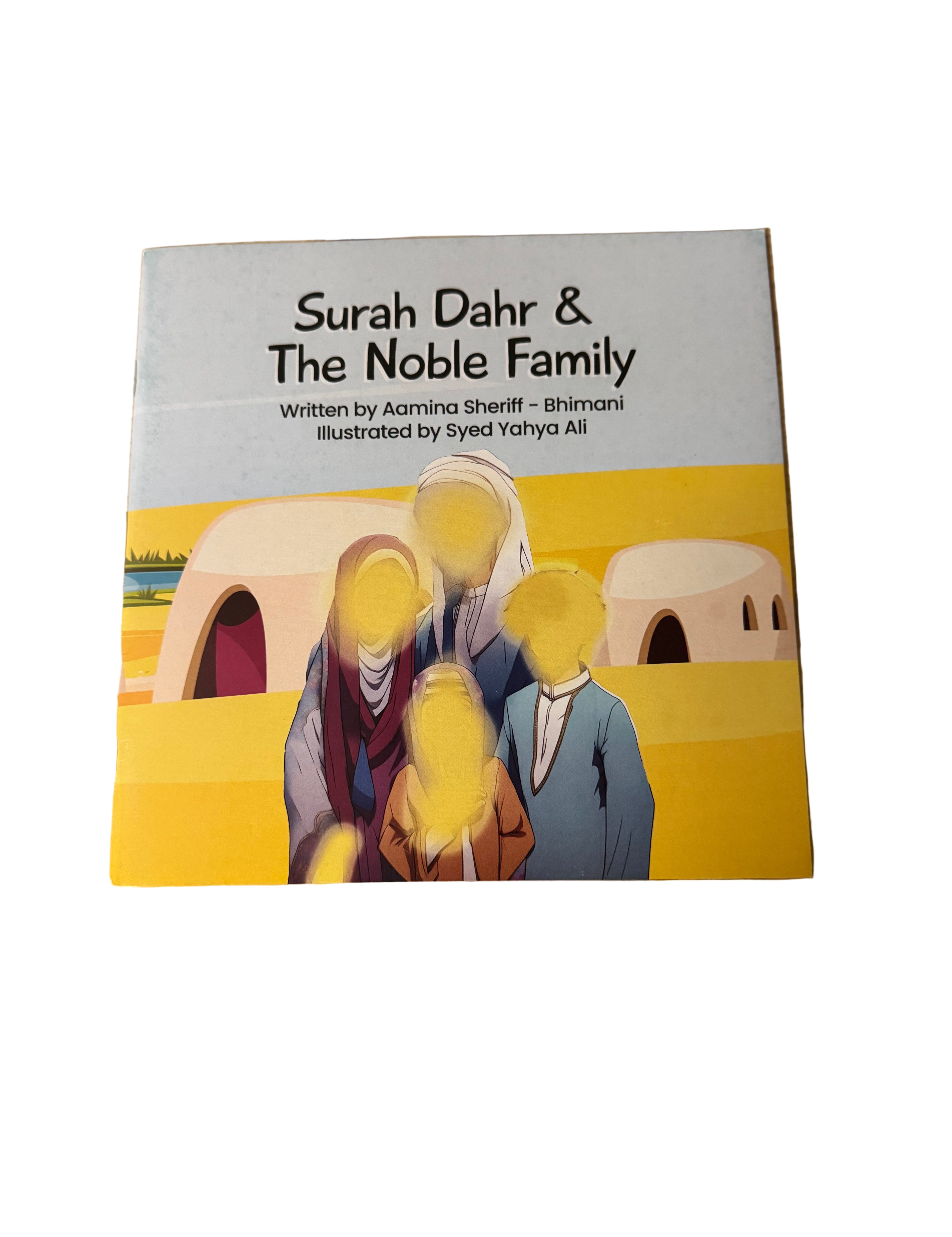 Book titled 'Surah Dahr & The Noble Family' on a wooden surface