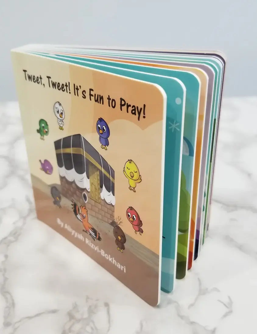 Children's book titled 'Tweet, Tweet! It's Fun to Pray!' on a marble surface