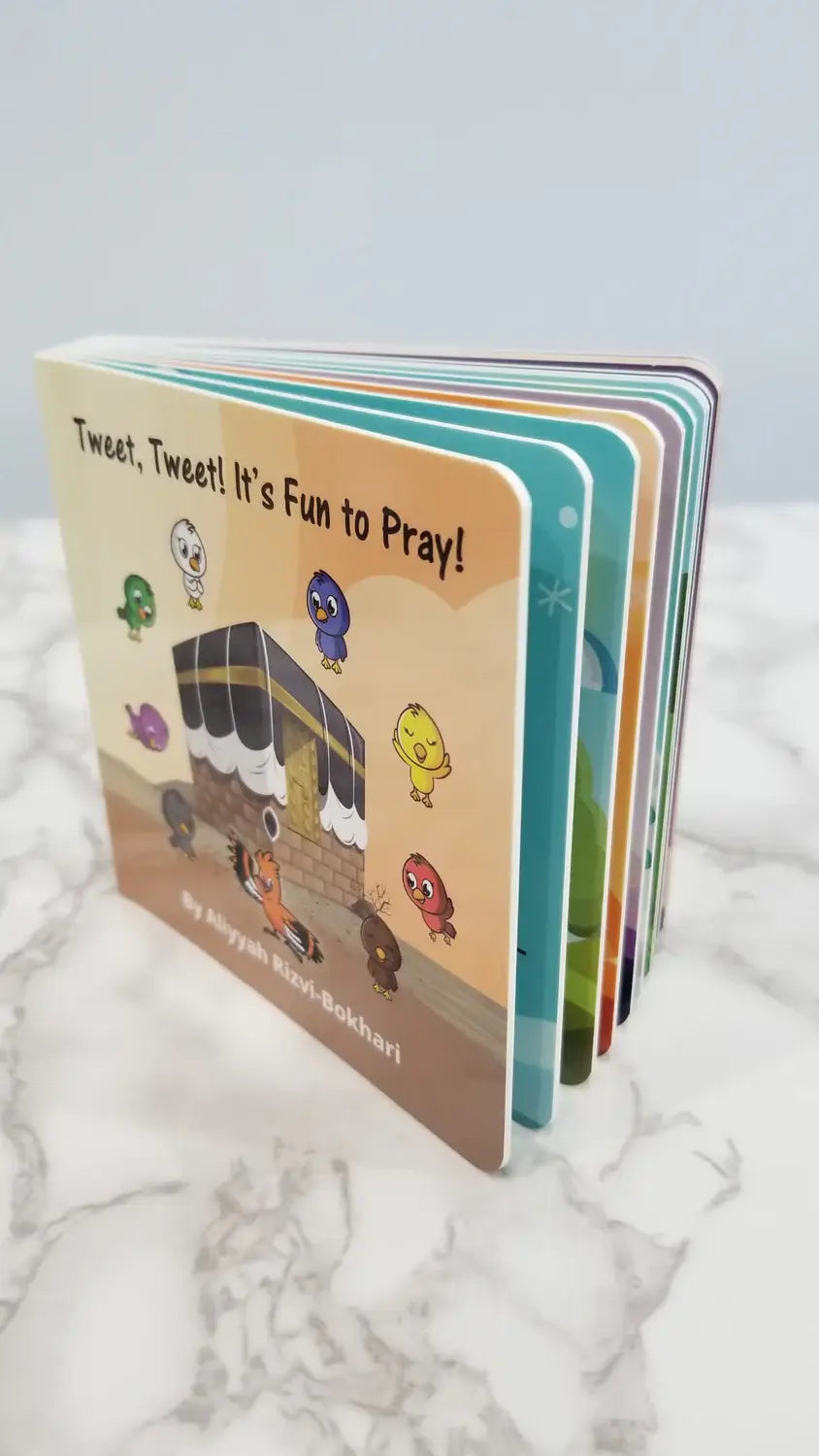 Children's book titled 'Tweet, Tweet! It's Fun to Pray!' on a marble surface