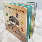 Children's book titled 'Tweet, Tweet! It's Fun to Pray!' on a marble surface