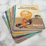 Stack of colorful children's cards on a marble surface