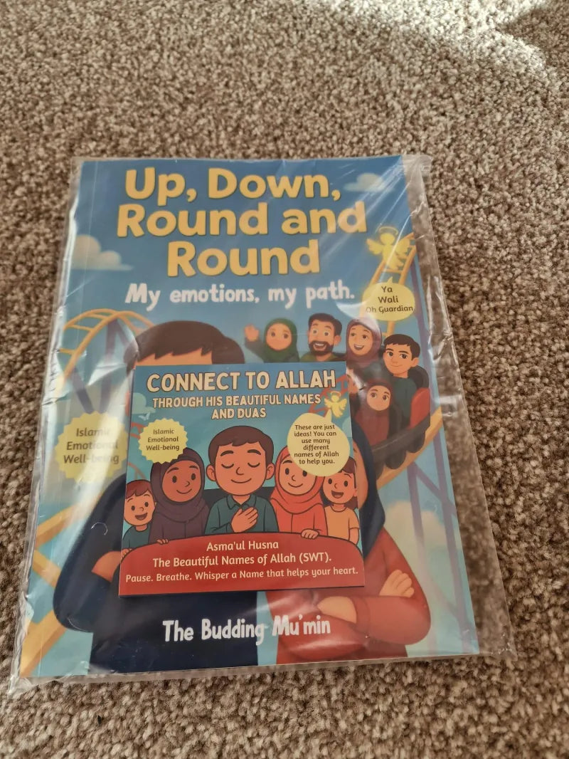 Children's book titled 'Up, Down, Round and Round' on a carpeted floor.