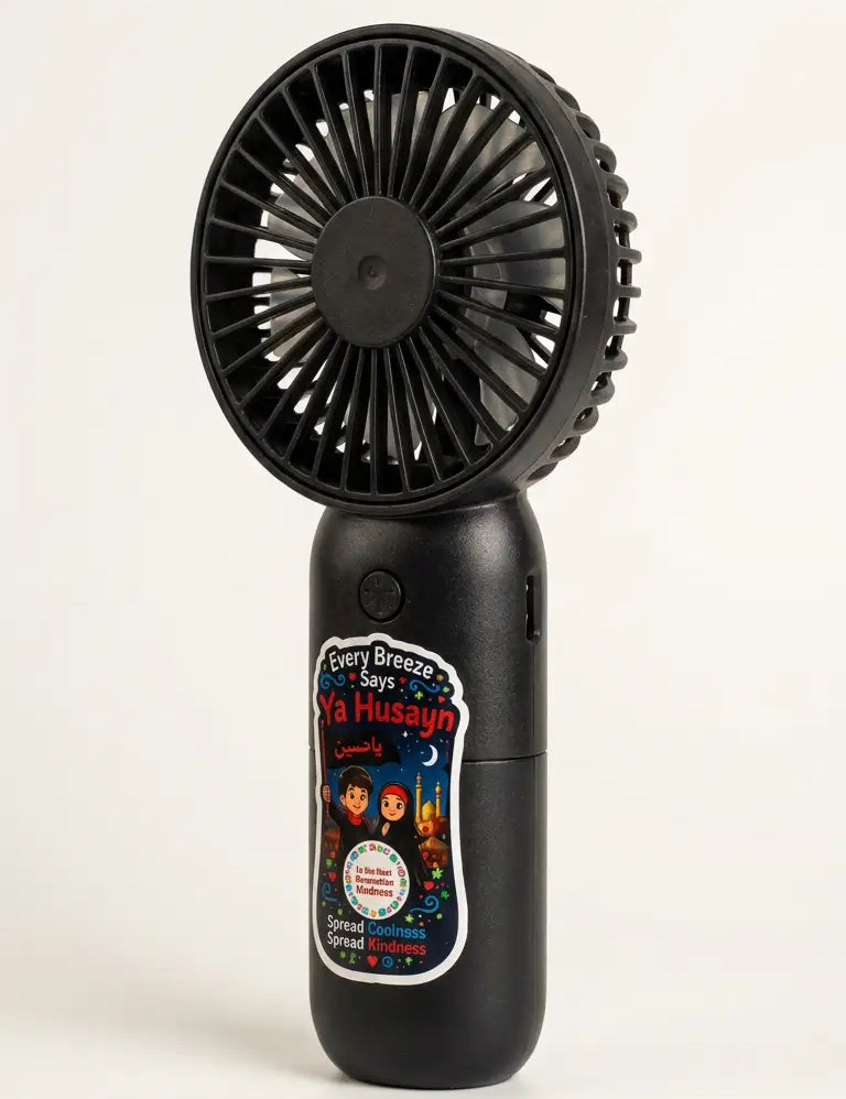 A black handheld personal fan with a circular fan head and a cylindrical body, featuring a colorful printed label on the front, photographed against a plain white background.