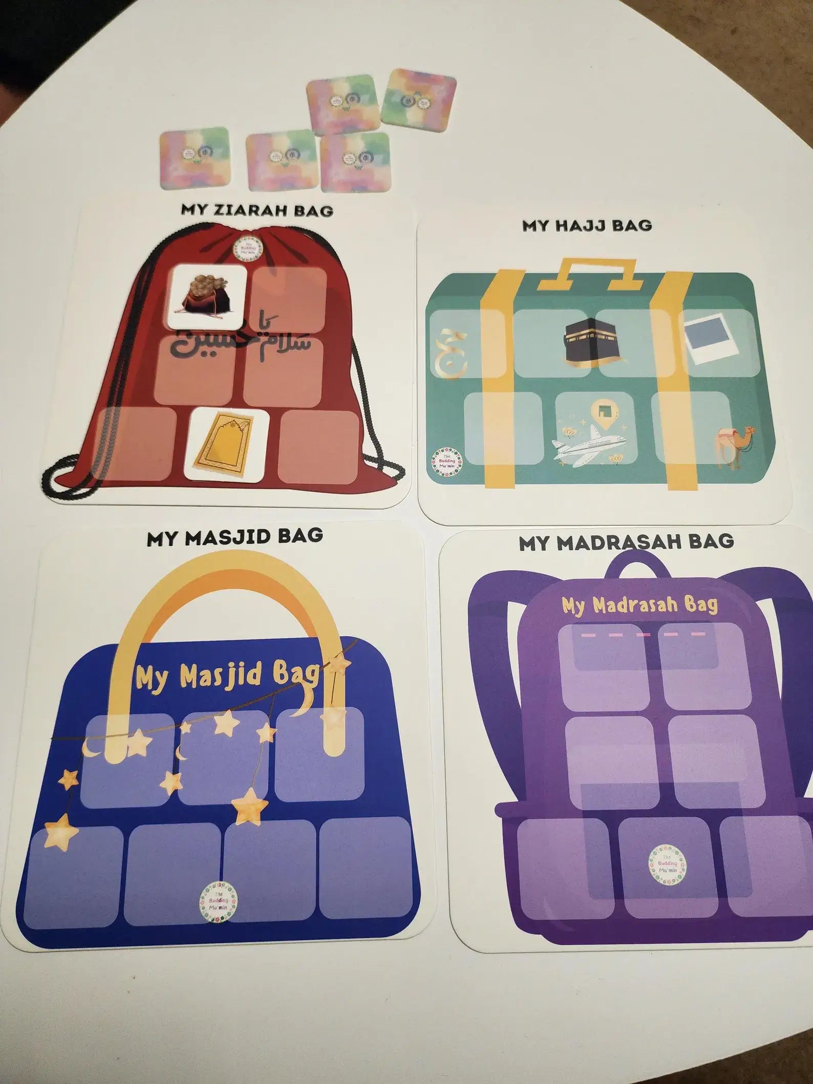 Four bags labeled 'My Ziarah Bag', 'My Hajj Bag', 'My Masjid Bag', and 'My Madrasah Bag' on a white background.