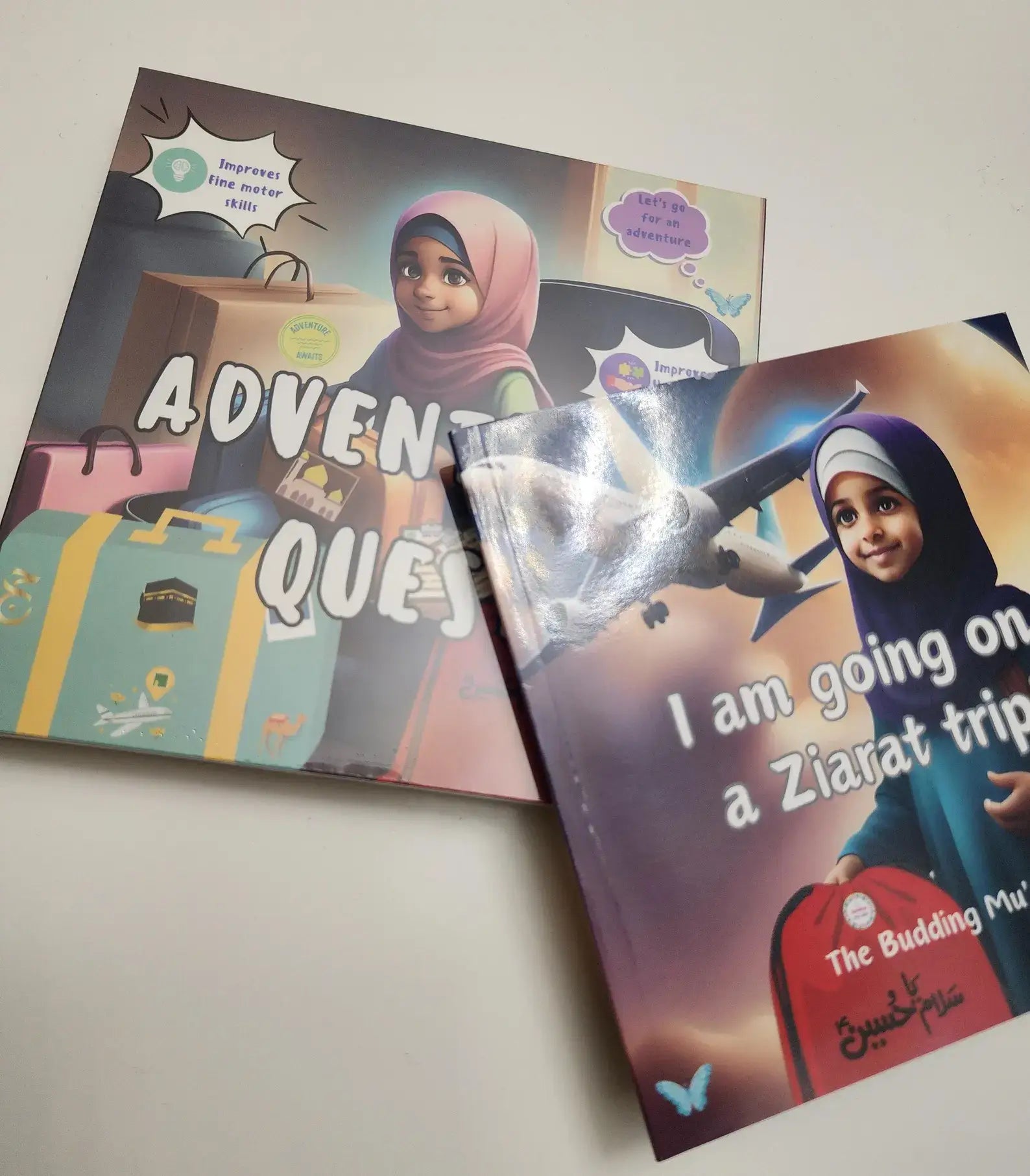 Two books titled 'Adventures' and 'I am going on a Ziarat trip' with a child on the cover.
