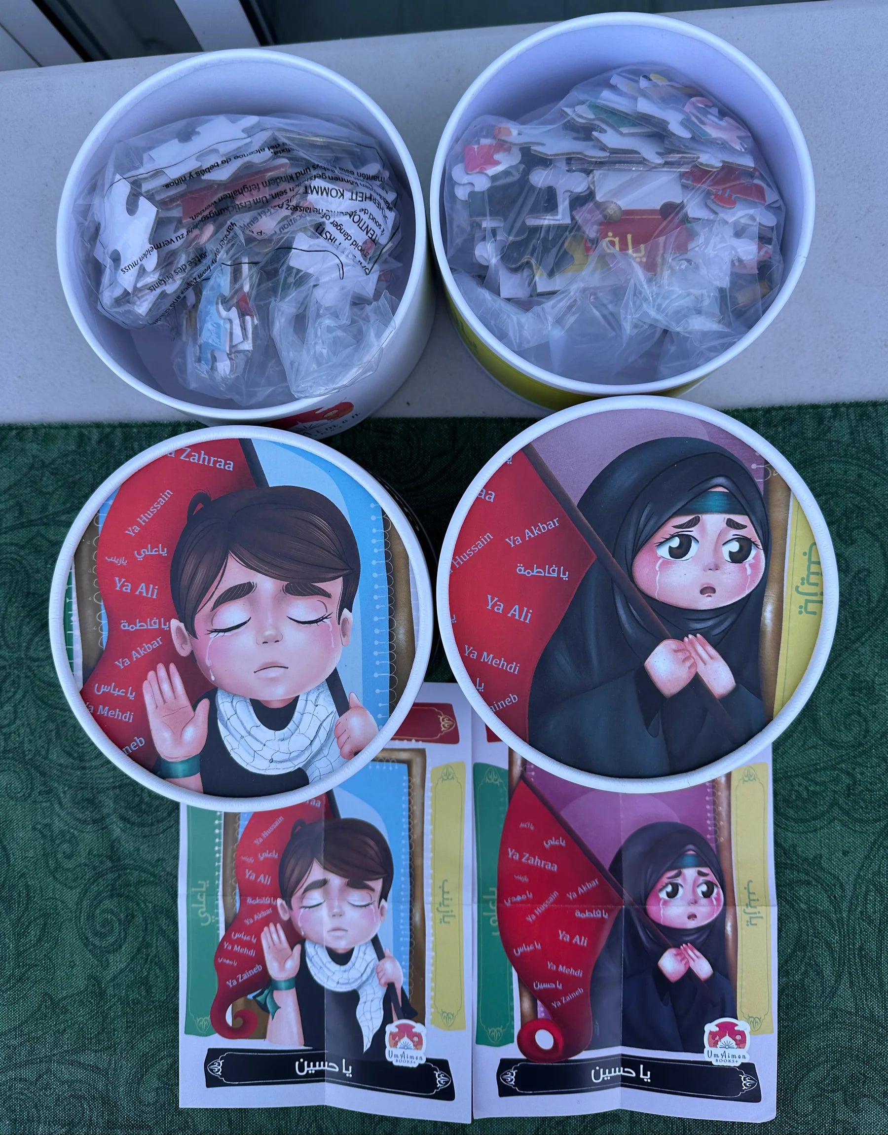 Two containers filled with jigsaw puzzles featuring illustrated characters commemorating Imam Husayn