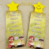 Two magnetic bookmarks with star-shaped holders on a textured surface, featuring text and images of children reciting the Quran.