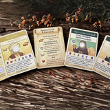 Four cards with illustrations and text on a wooden surface with decorative elements.