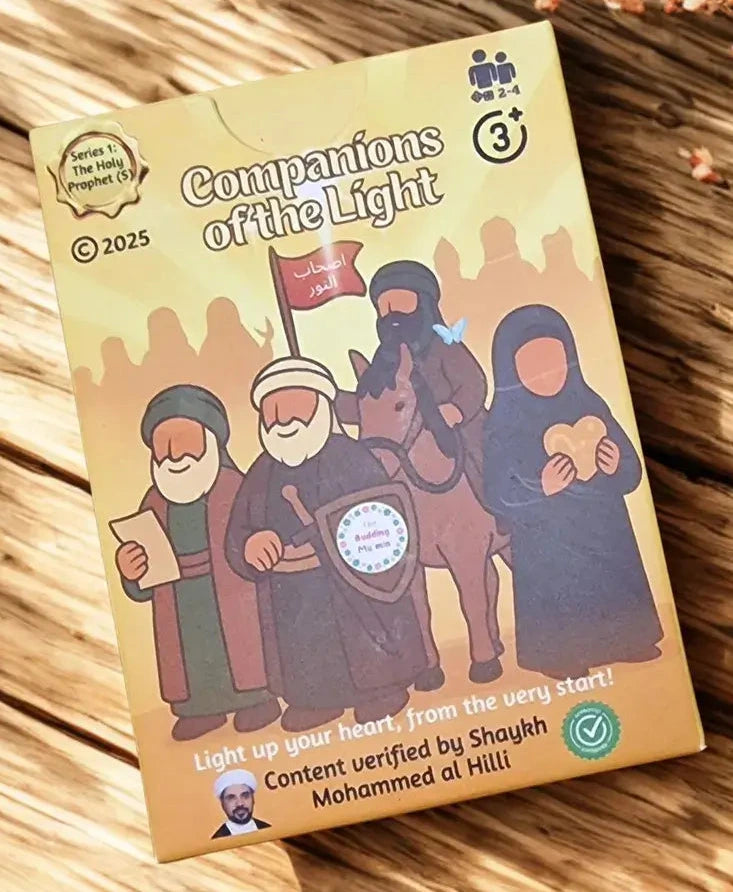 Two cards from 'Companions of the Light' game on a wooden surface with decorative elements.