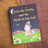 Book titled 'Fufu the Firefly and the Surah al.Fajr trail' on a textured surface by The Budding Mu'min Shia Kids Children Story Book