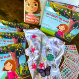 Inside of the starter kit for young girls pre-hijab. With stickers and hijab