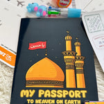 Black book with mosque illustration and text on a surface with stationery items