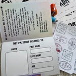 Children's Ziyarah passport with stamps and crayons on a textured surface