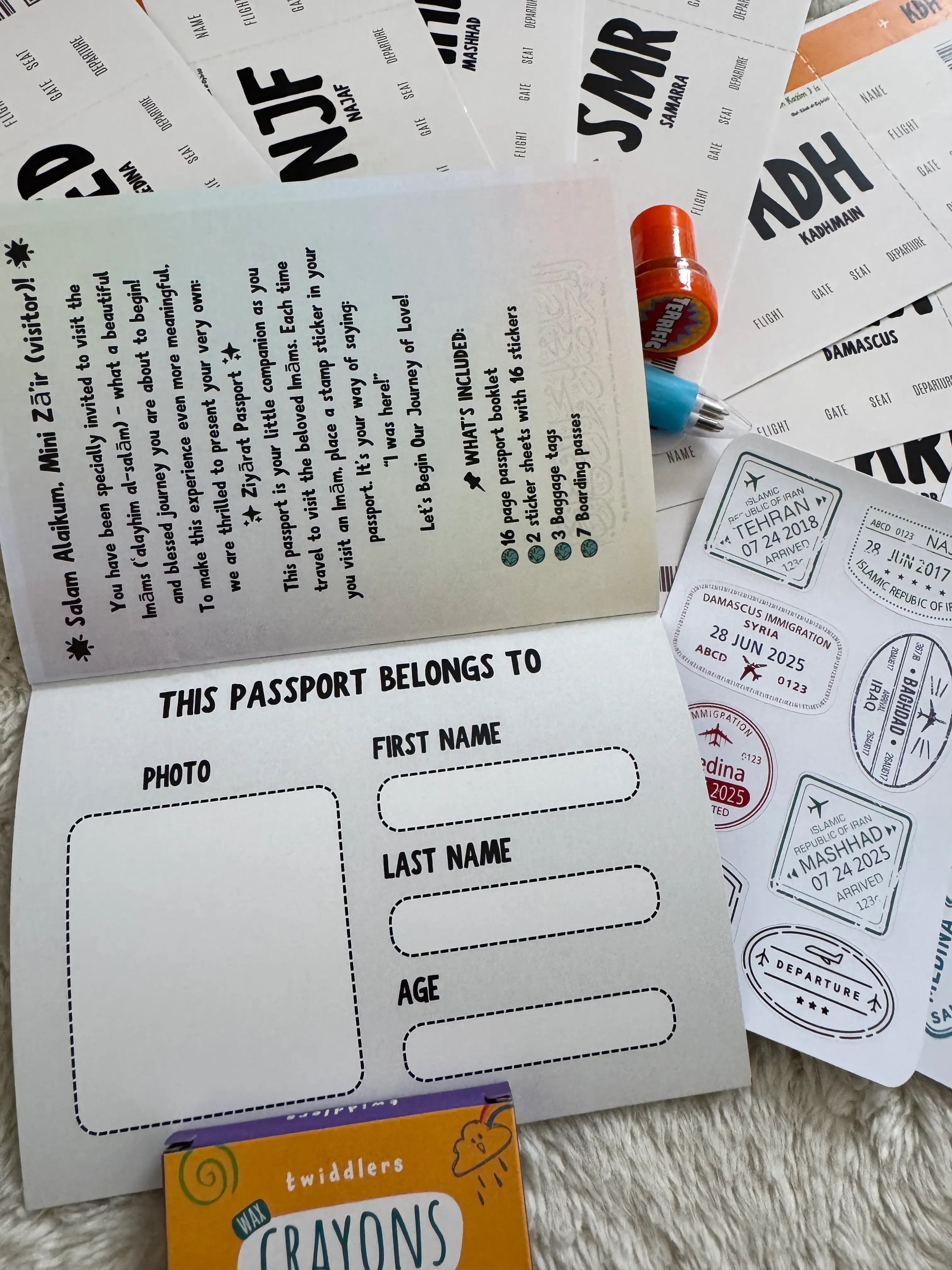 Children's Ziyarah passport with stamps and crayons on a textured surface