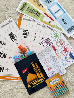 Collection of Ziyara-themed items including a passport book, stamps, and tickets on a textured surface.