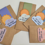 A collection of colorful magnetic bookmarks with the text 'My Imam My Best Friend' and a sun behind a cloud design.