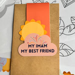 A collection of colorful magnetic bookmarks with the text 'My Imam My Best Friend' and a sun behind a cloud design.