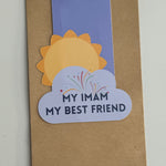 A collection of colorful magnetic bookmarks with the text 'My Imam My Best Friend' and a sun behind a cloud design.