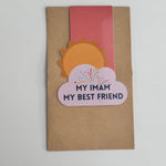 A collection of colorful magnetic bookmarks with the text 'My Imam My Best Friend' and a sun behind a cloud design.